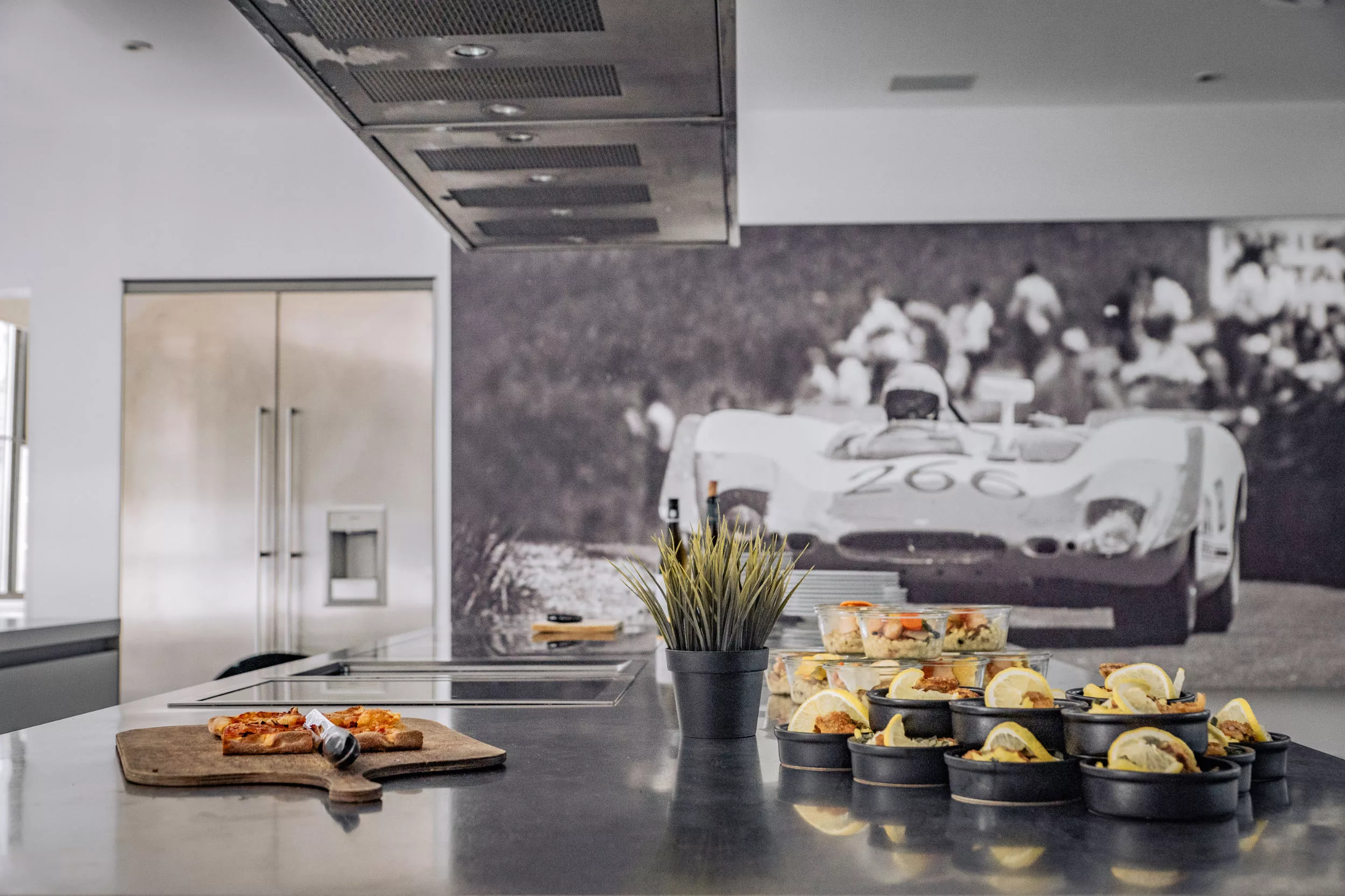 Modern event location with stylish cuisine, snacks and a large motorsport photo wall as decoration