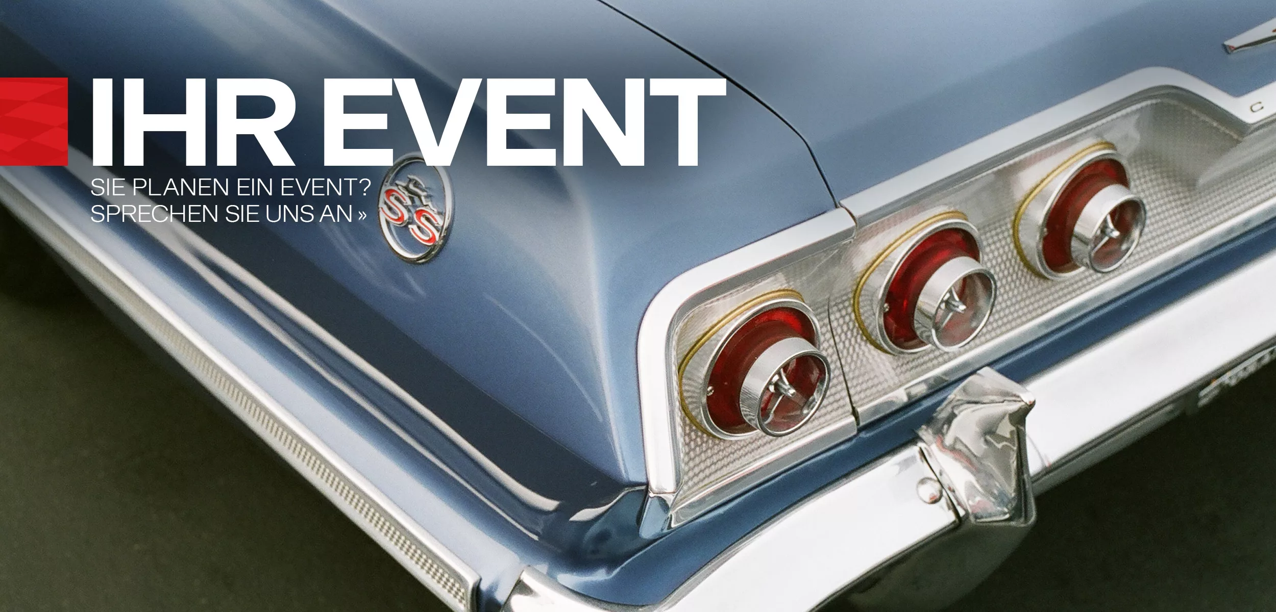 Rear of a blue vintage car as advertising for event planning and event location